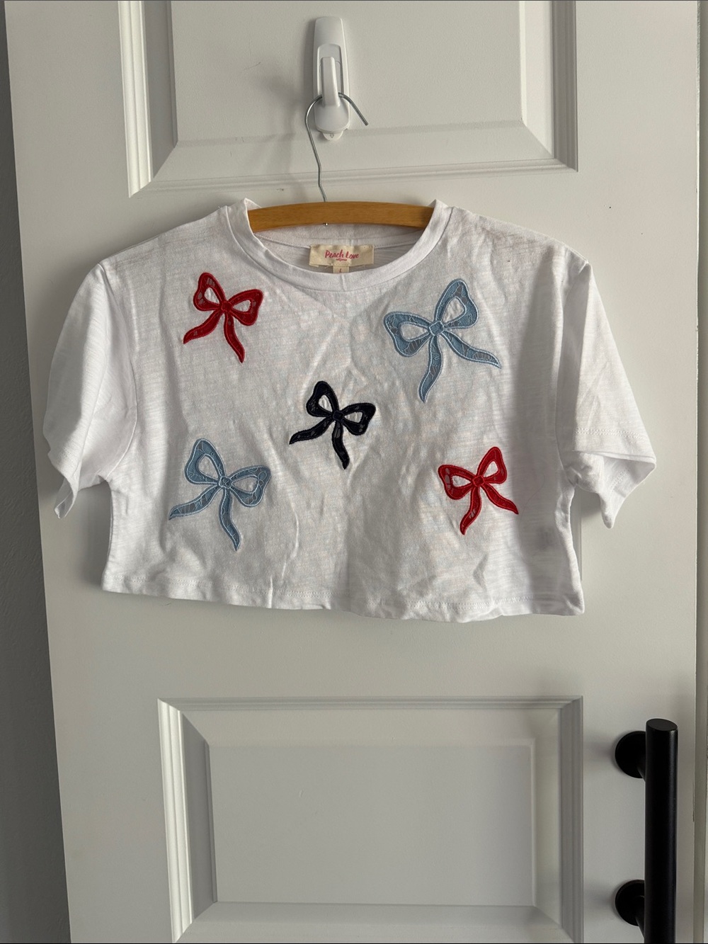 Peach love CA womens White Cropped Tee with Red, Blue & Black Bows large